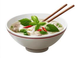 A bowl of pho with chopsticks and basil leaves photo