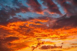 Dramatic sunset sky backdrop photo. Orange clouds photo