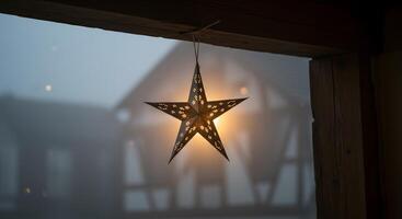 A star hanging from a window in the fog photo