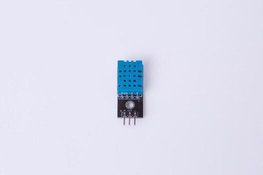 Malang, March 24, 2025. Front view of DHT11 temperature and humidity sensor module. Digital sensor for Arduino, IoT projects, weather monitoring, home automation. White background. photo