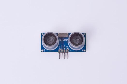 Malang, March 24, 2025. Front view of HC-SR04 ultrasonic sensor module on white background. Distance measuring sensor for Arduino, robotics, obstacle detection, DIY electronics. photo