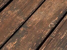 Weathered Wooden Planks Texture. Aged weathered wood planks with natural grain patterns and rustic gaps photo