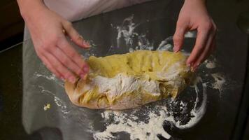cheff Hands kneading dough on table preparing bread pastry yeast flour Cooking food concept background slow motion video