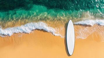 Stand up paddle board resting on golden sand at tranquil beach inviting summer adventure and coastal relaxation photo