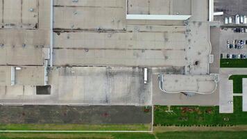 Exterior of a factory with parking spaces. industry on field. Camera rising. Top view. video