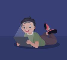 little boy using smartphone lying on the floor at night in the darkroom vector