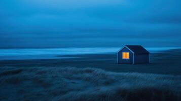 Lonely Beach House Illuminated At Night photo