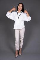 Full Body Portrait of Young Confident Woman Thumbs Up in Approval or Recommendation Isolated Background photo