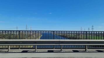 Construction crane rising over Kiel Canal from bridge on Autobahn A7 video