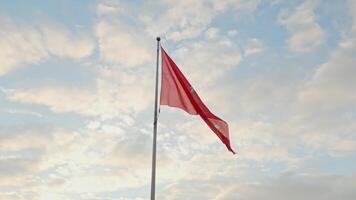 Historical Lithuanian flags, coat of arms of Lithuania, consisting of an armour-clad knight on horseback holding a sword and shield, is also known as Vytis, waving in the wind against blue sky video