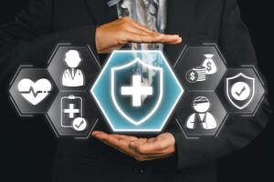 Conceptual image of health insurance with hands shielding medical and financial icons, symbolizing protection and security. photo