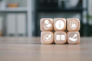 Wooden blocks with icons symbolizing confidentiality, security, and information management in a business context. photo