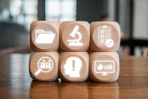 Wooden blocks with icons symbolizing research, analysis, and data, ideal for illustrating case study concepts. photo