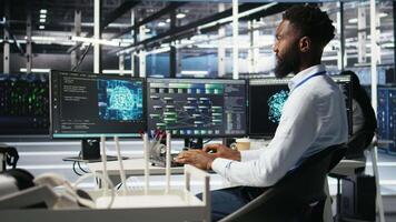 Server hub admin using AI neural network node tree program to optimize system health. Data center IT professional analyzing equipment issues using deep learning AI visualization, camera A video