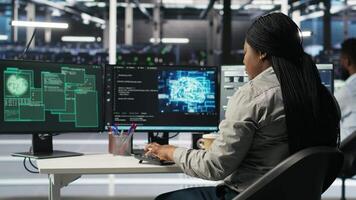 Server farm engineering team collaborating to protect against data theft during cyberattack. Data center coworkers rushing to safeguard infrastructure systems during security breach, camera B video
