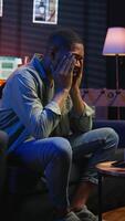 Vertical Stressed young adult fearing failure and struggling with deadlines, working under pressure and stress from superiors. Frustrated worried employee making mistakes, burnout and tension. Camera A. video