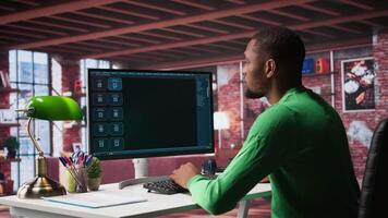 Black male freelancer at home uses AI chatbot for task completion, automation and machine learning. Young adult uses artificial intelligence to generate new ideas with prompts. Camera B. video