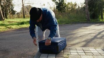 Man Checking The Suitcase To Procede The Trip video