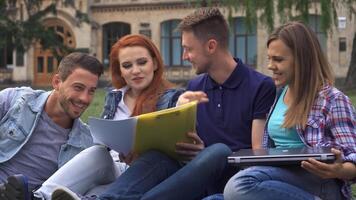 Students enjoy a lively study session on the campus lawn video