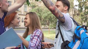 Dynamic group of students sharing a moment on campus video