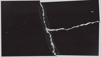 A black and white photograph of a broken window video