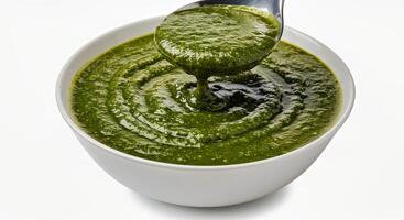 Mulukhiyah Showcasing Its Signature Viscous Slightly Thick Texture and Rich Dark Green Color Gently Ladled into a Bowl Variation photo