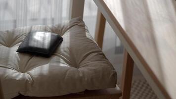 Soft cushion on a chair with a wallet resting nearby. lost wallet concept, video