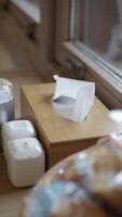 Decorative tissue box and condiments near window in cozy setting video