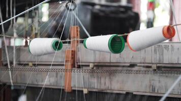 Exploring the intricate process of textile production in a workshop video