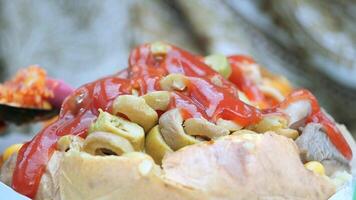 Stuffed potato with olives and ketchup video