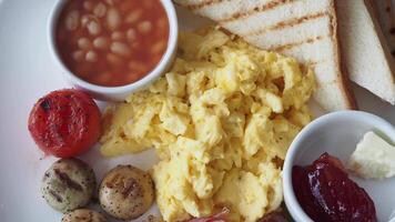 Delicious breakfast spread with eggs, toast, and beans video