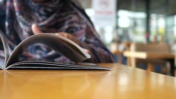 Exploring a menu in a cozy cafe setting video