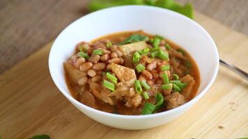 Vegetable stew with meat and potatoes in a white bowl on the table video