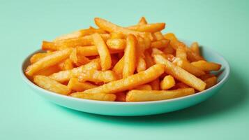 Delicious Cheese Fries Served on a Plate Against a Fresh Mint Green Background Perfect for Food Blogs and Menus photo