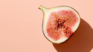 A Stunning Ripe Fig Cut Open to Reveal Its Juicy Interior Against a Soft Pale Orange Backdrop, Perfect for Food Photography and Culinary Inspiration photo
