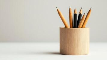 Elegant Simple Wooden Pen Holder on a Pastel Cream Background Ideal for Organizational and Decorative Use in Home or Office Settings photo