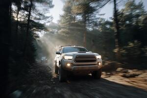 A rugged white off-road truck speeds through a dense pine forest on a muddy trail, its front LED lights cutting through the mist and shadows. photo
