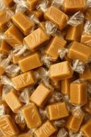 Caramel candy in clear wrappers photo