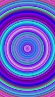 Vibrant vertical abstract background with a colorful repeating pattern of layered concentric circles. Visually engaging animation suitable for digital artwork, website backgrounds and advertising. video