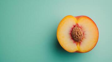 Freshly Sliced Peach on a Soft Pale Green Background Perfect for Health and Food Related Themes photo