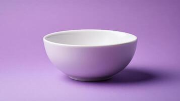 Elegant Simple White Ceramic Bowl Displayed on a Solid Lavender Background for Creative and Modern Visual Uses photo