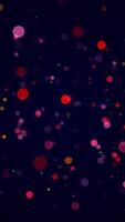 Abstract particle background with shiny colorful sphere particles. This vibrant glowing multicolored vertical background animation is full HD and looping. video