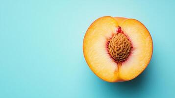 Sliced Peach on a Pale Blue Background Perfect for Healthy Food Blogs, Cookbooks, and Culinary Advertisements photo