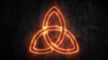 Fiery Celtic Trinity Knot symbol flaming on a dark stone background. Mystical elemental energy concept. video