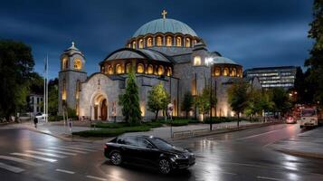 An illuminated Byzantine-style cathedral stands majestically at night, with glowing domes and elegant stone architecture capturing urban serenity photo