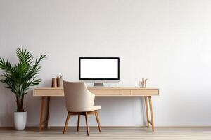 A computer desk with a white computer monitor and a chair photo