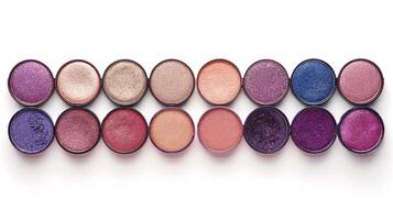 A row of makeup containers with different colours photo