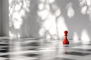 A red chess piece stands in front of a white wall photo