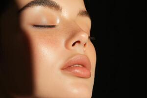 A woman with freckles and a shadow on her face photo