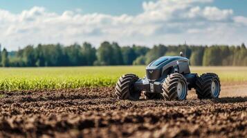 Advanced robotic tractor operates on a vast farm during clear sunny weather photo